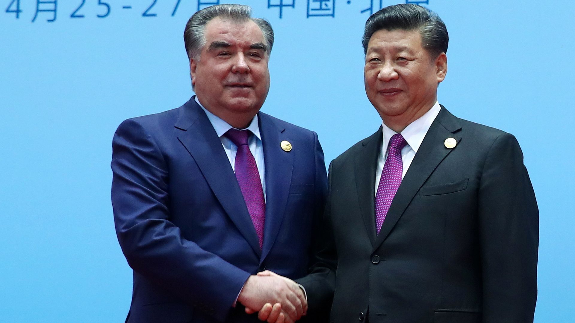 Xi Jinping and Emomali Rahmon shaking hands