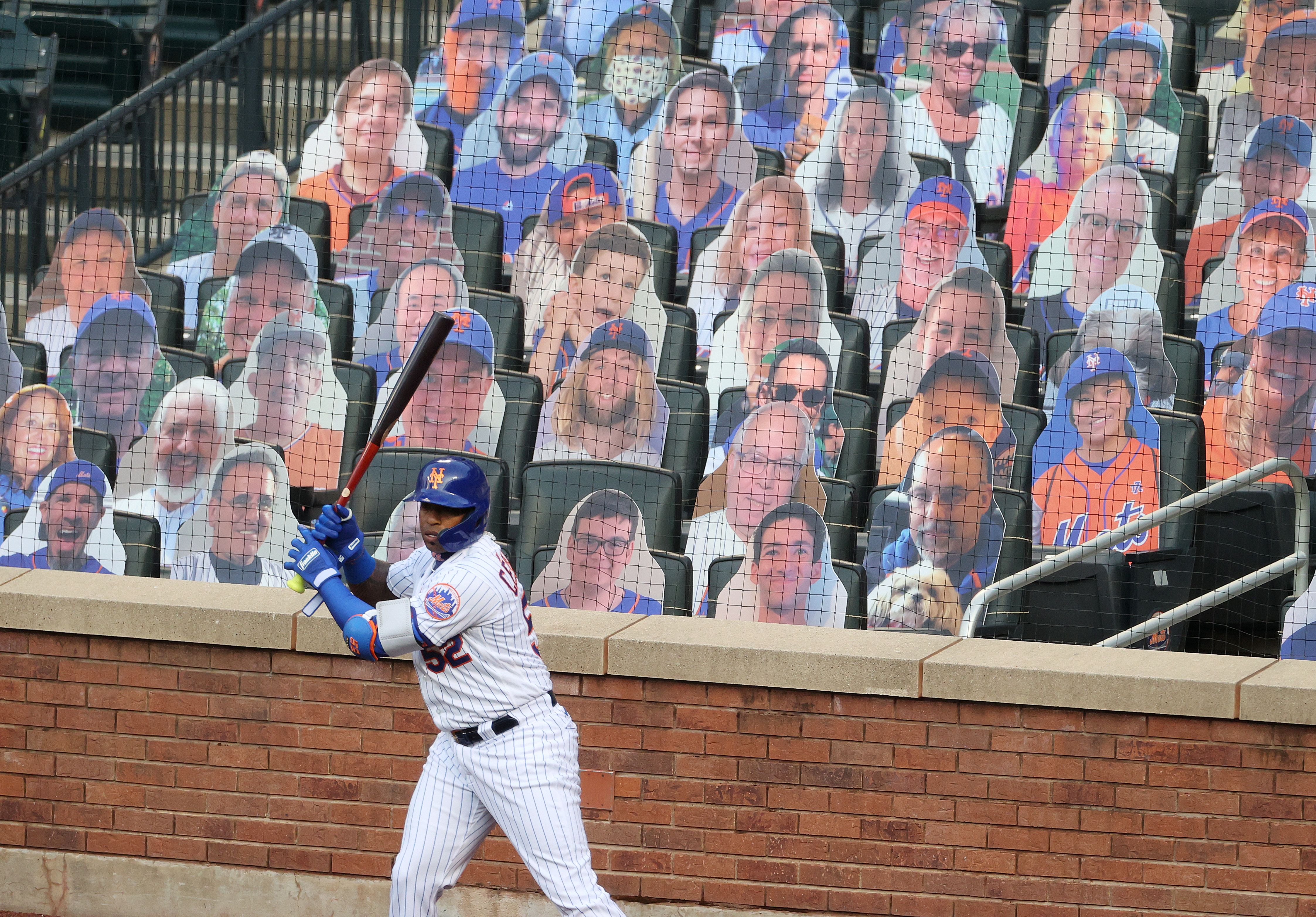 Yeonis Cespedes in front of cardboard cutout fans
