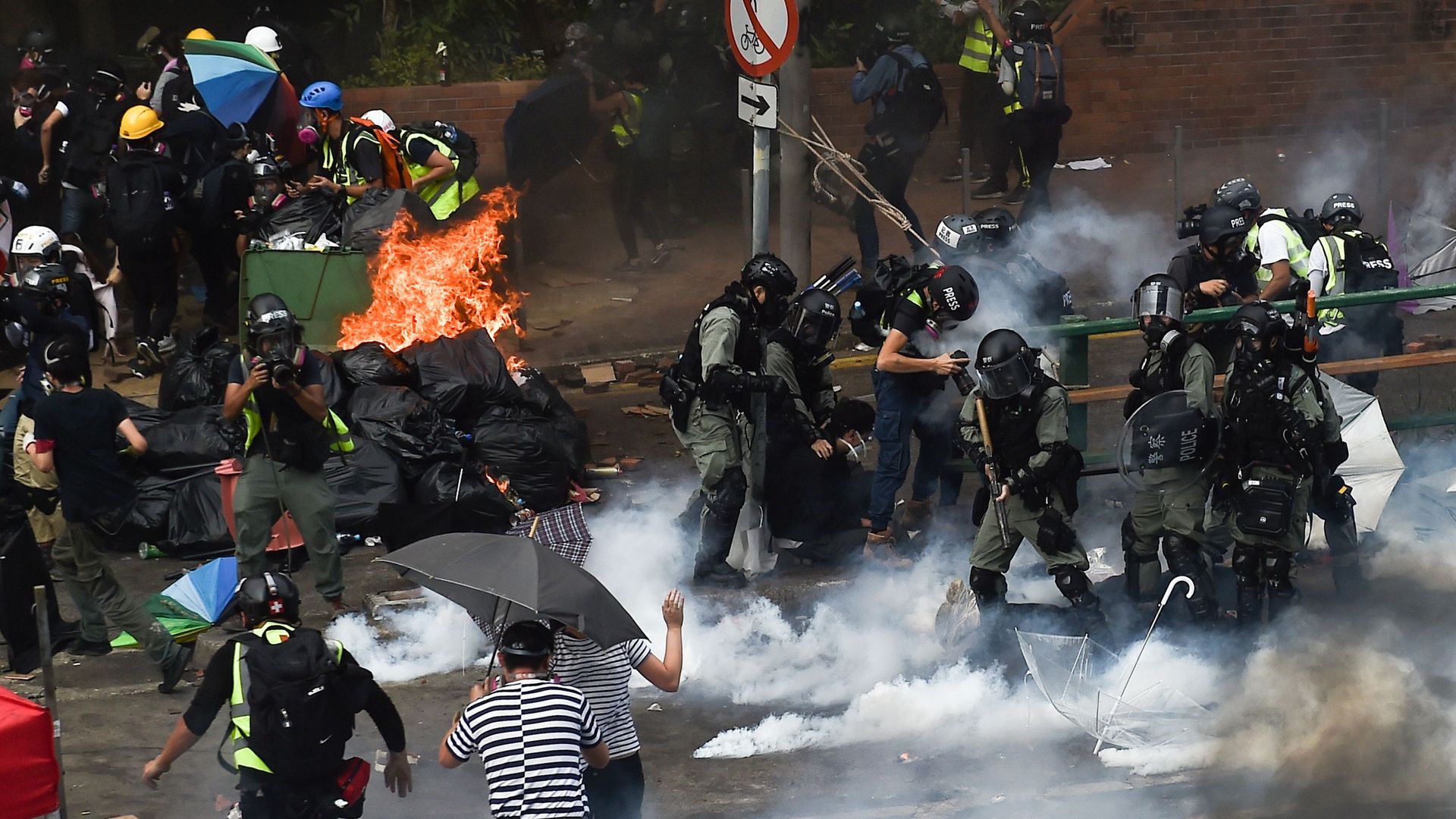 Riot police and protesters clash in the Hung Hom district of Hong Kong on Monday