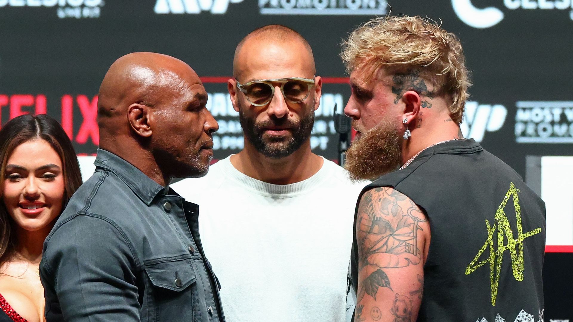 Mike Tyson and Jake Paul face off during a boxing press conference. 