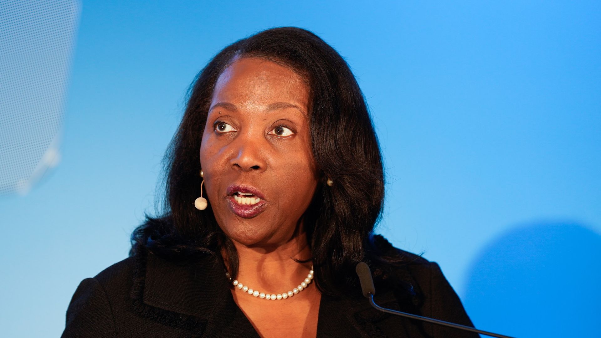 Federal Reserve governor Lisa Cook speaks at a podium