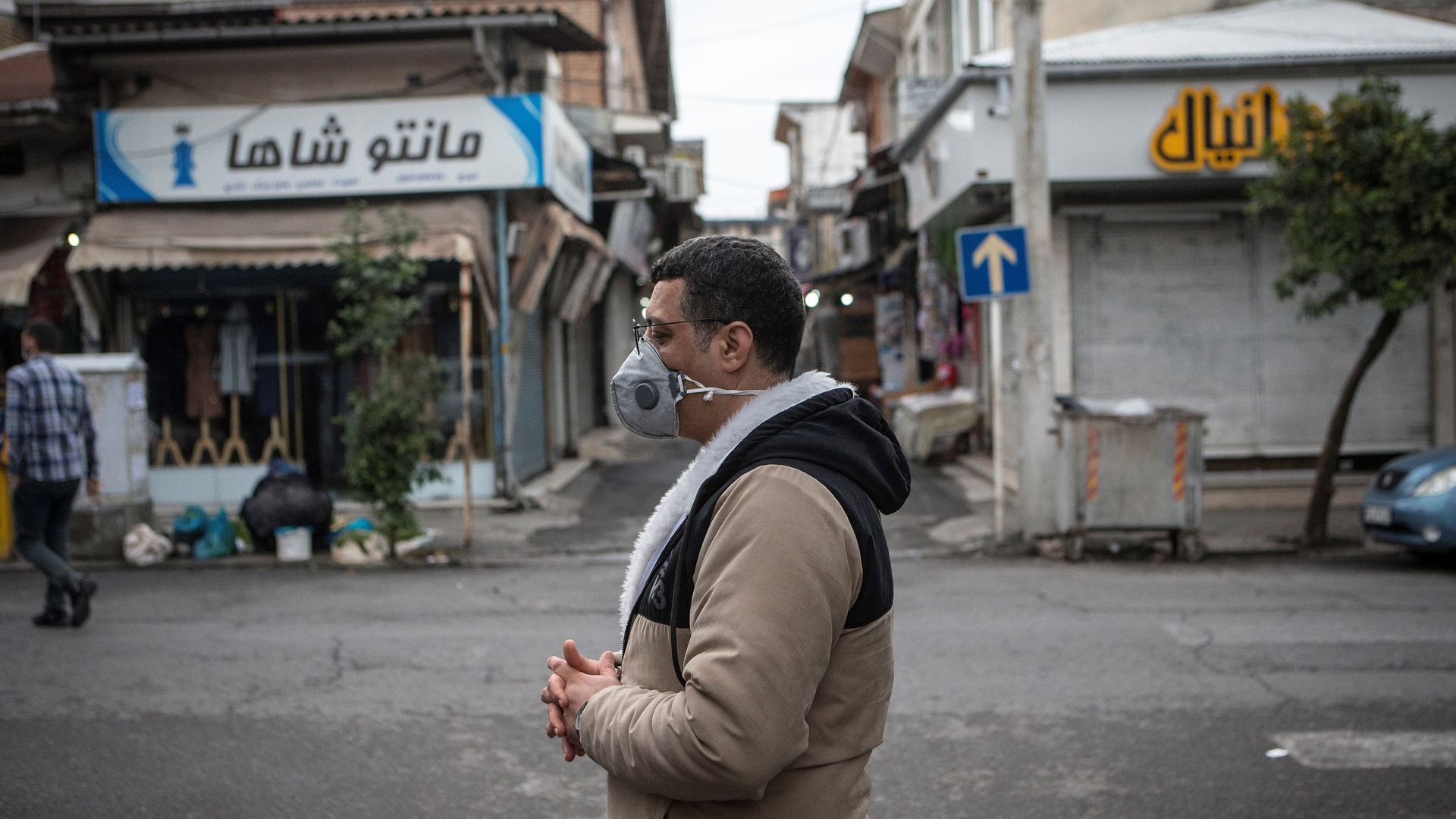 Picture of a man wearing a mask walking on the streets of Tonekabon in Northern Iran