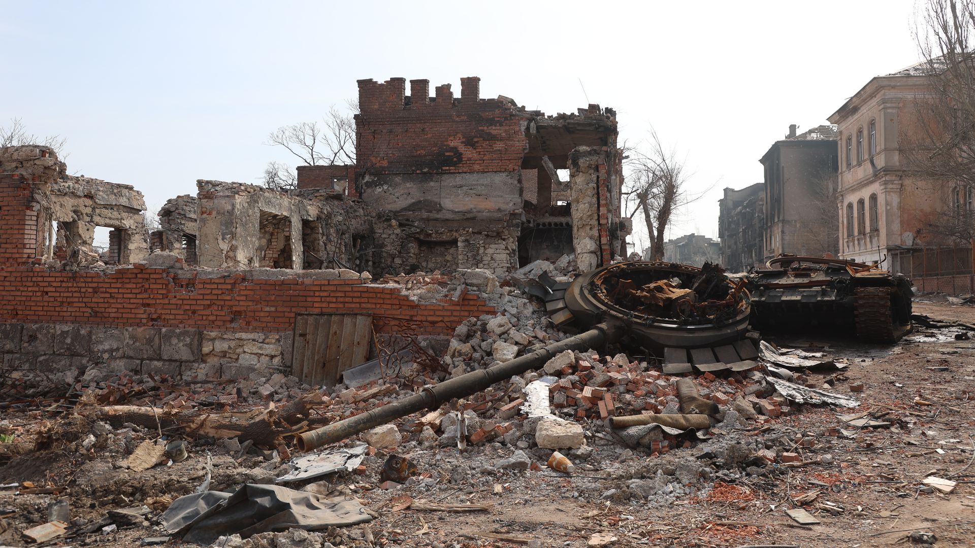 Photo of rubble, bricks and torn-down building in the aftermath of an explosion