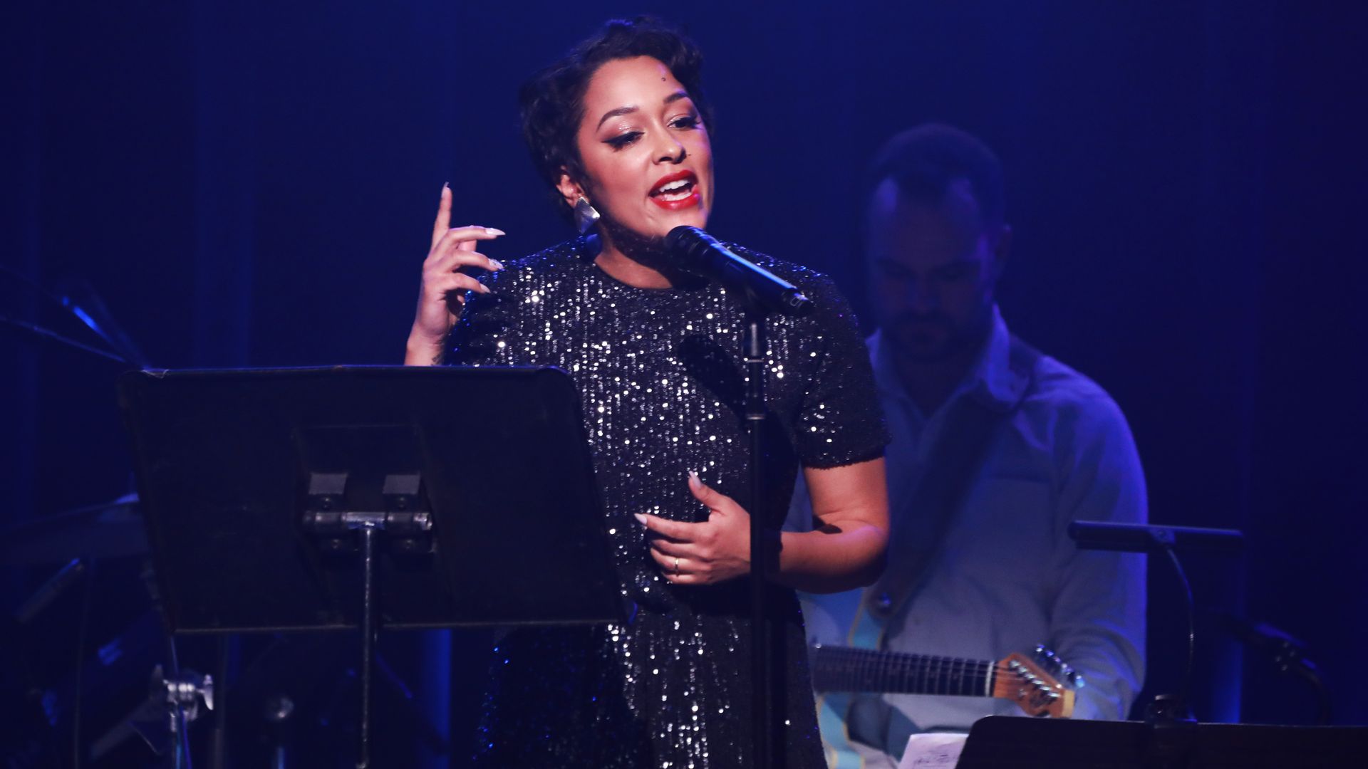 Photo of a woman performing on stage. 