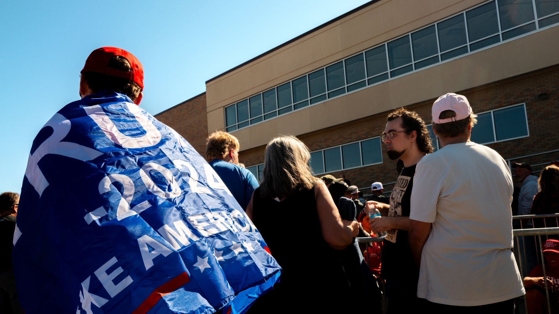 Attendees wait in line ahead of Republican presidential nominee, former U.S. President Donald Trump's campaign rally at the Prairie Du Chien Area Arts Center on September 28, 2024 in Prairie du Chien, Wisconsin.