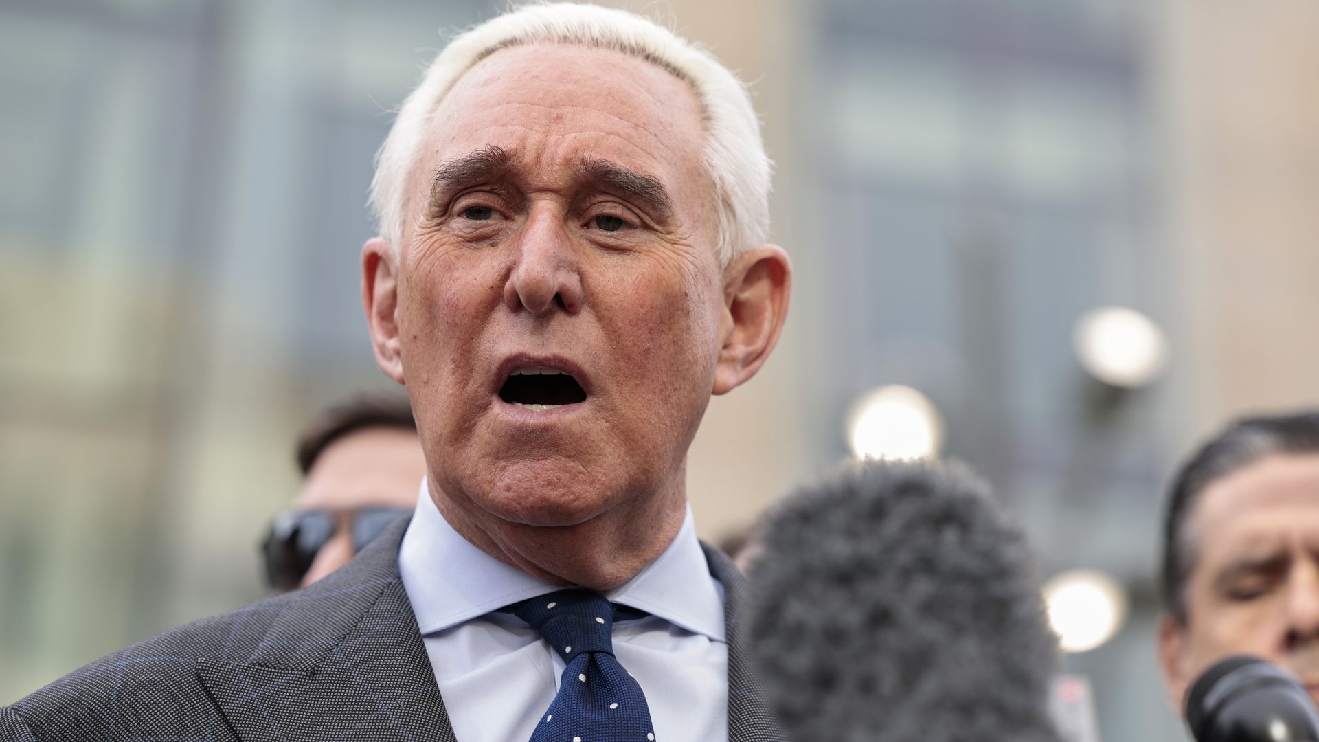 Roger Stone speaks to reporters in front of the Thomas P. O'Neill Jr. Federal Building after his deposition.