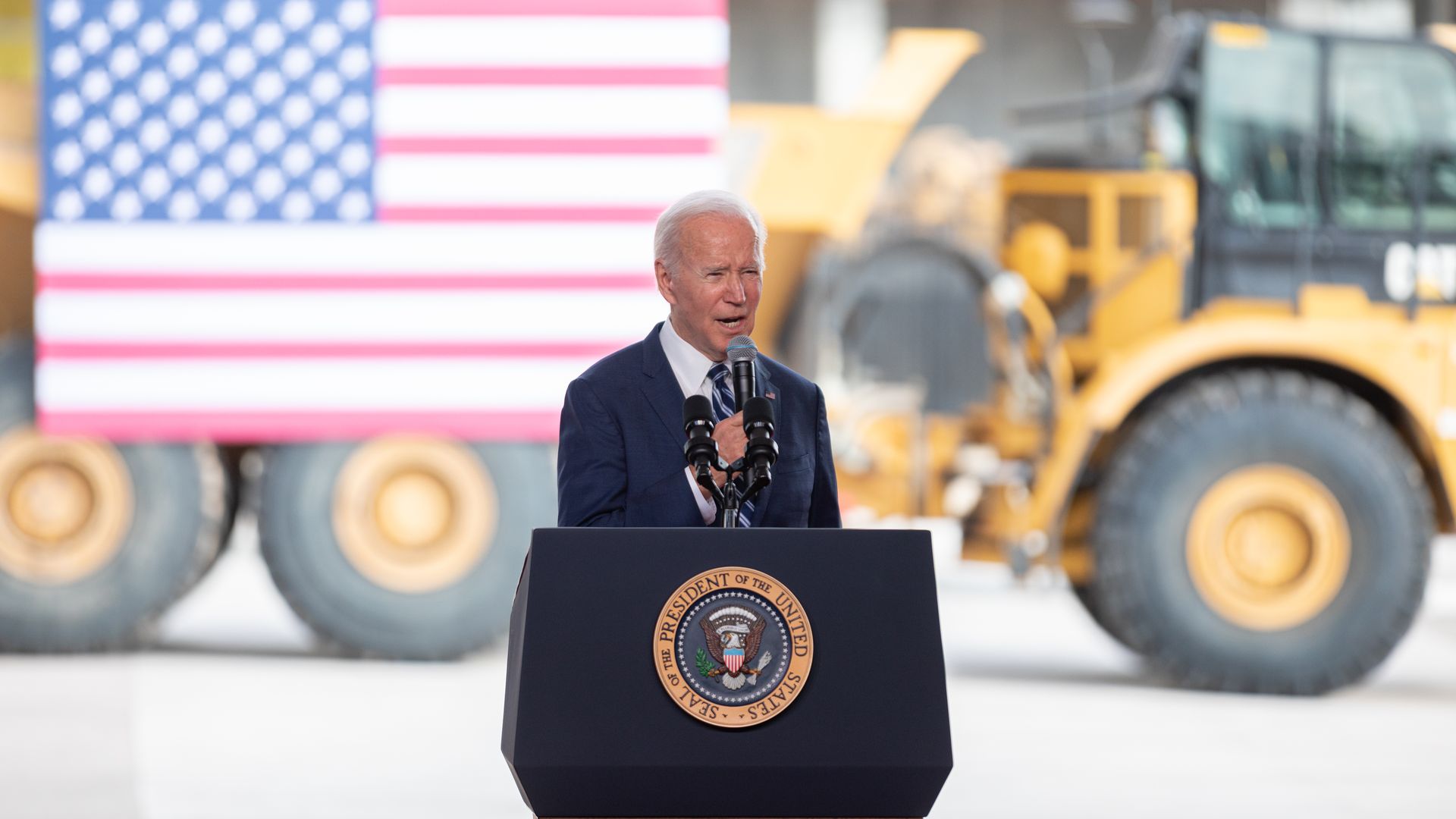 President Biden speaking in front of a construction site.