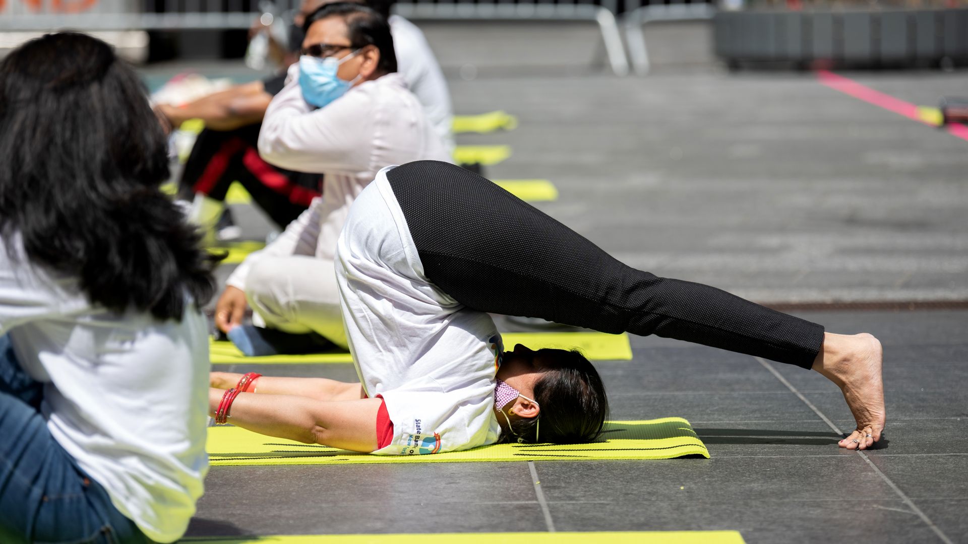 A yogi performing an uncomfortable looking pose in New York City.