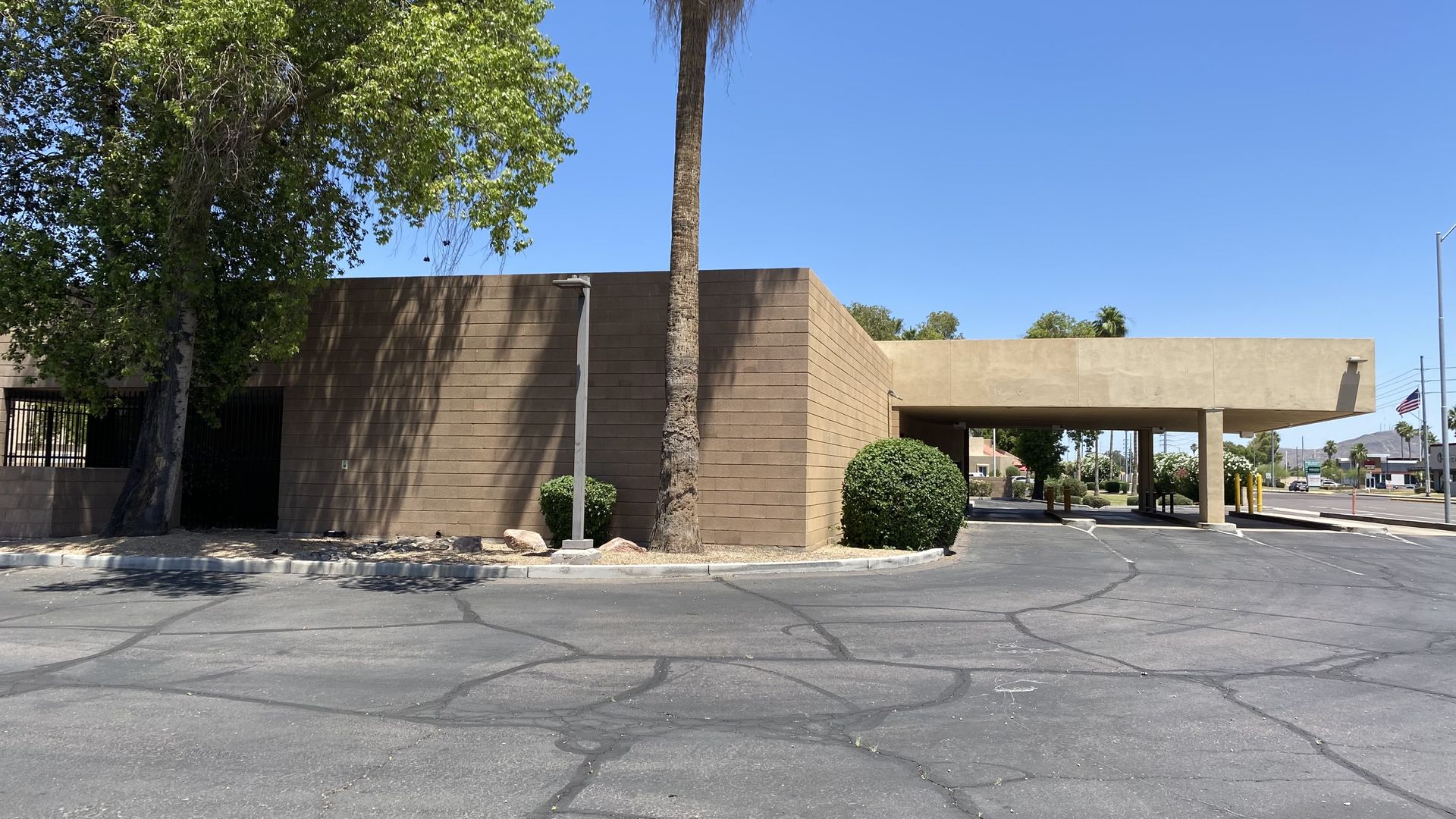 The drive through teller section of a closed bank building. 