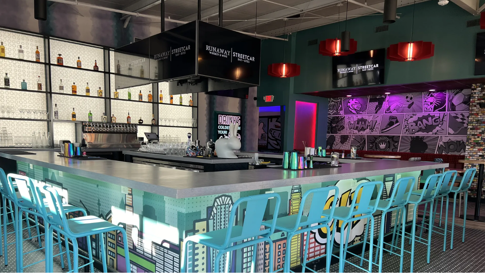 A bar with blue chairs wrapped around it