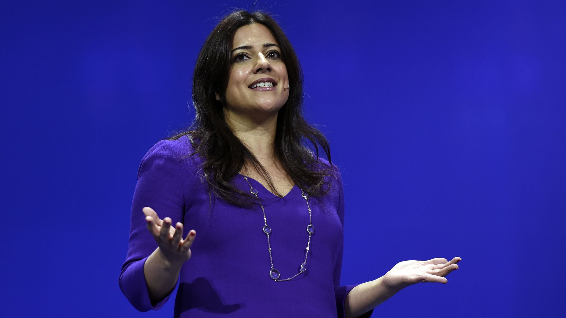 Reshma Saujani giving a speech on stage