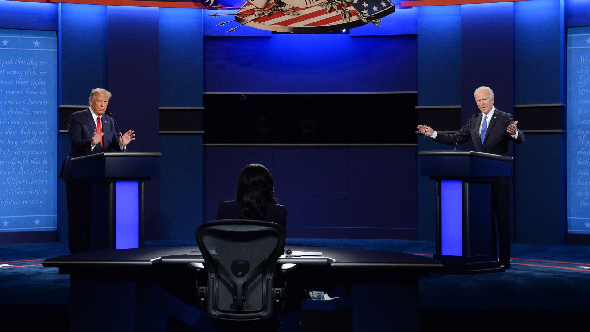 Trump and Biden appear on stage during a presidential debate in 2020.
