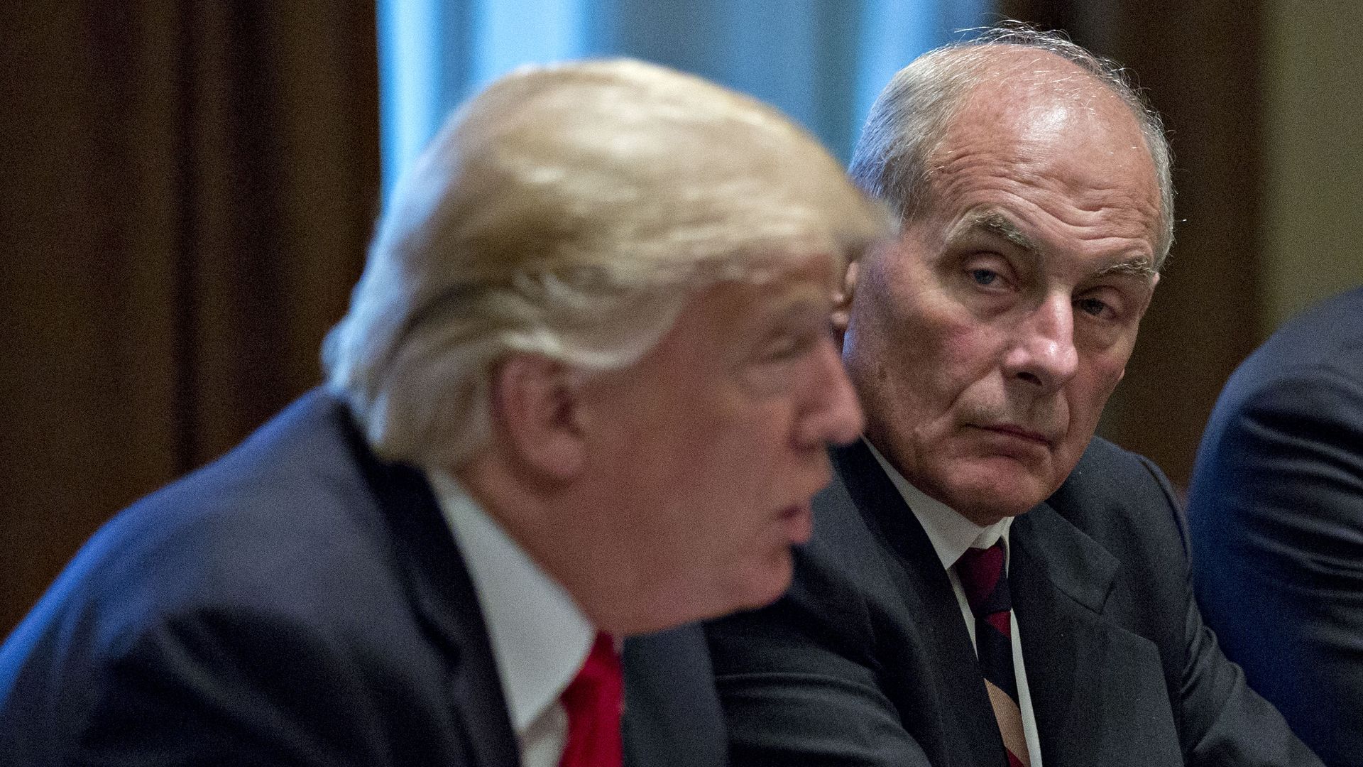 White House chief of staff John Kelly listens as U.S. President Donald Trump speaks at a briefing with senior military leaders in the Cabinet Room of the White House October 5, 2017 in Washington, D.C.