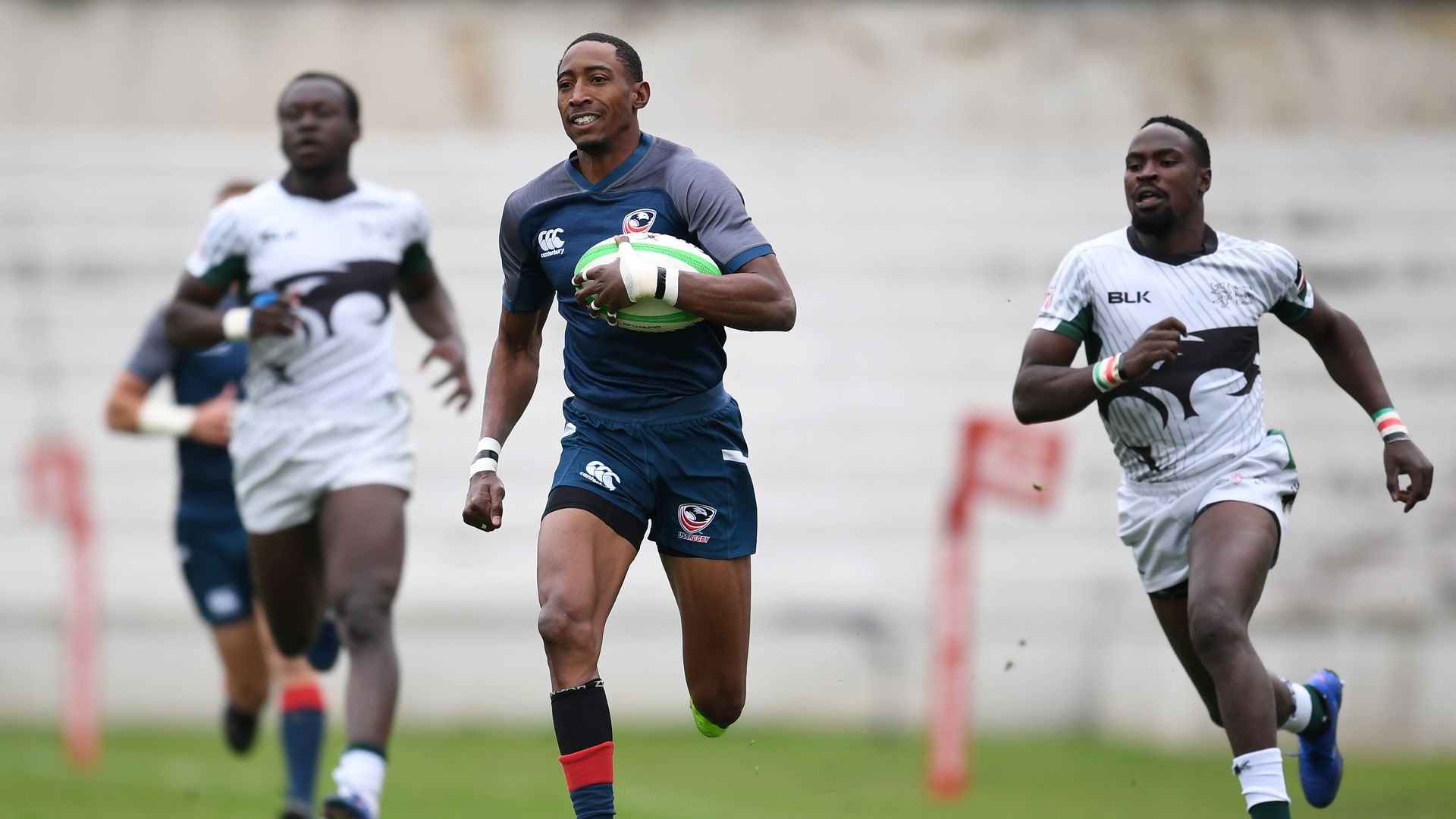 Perry Baker of the USA brakes the line during match seventeen between Kenya and the USA during Day Two of The Madrid Rugby Sevens International Tournament