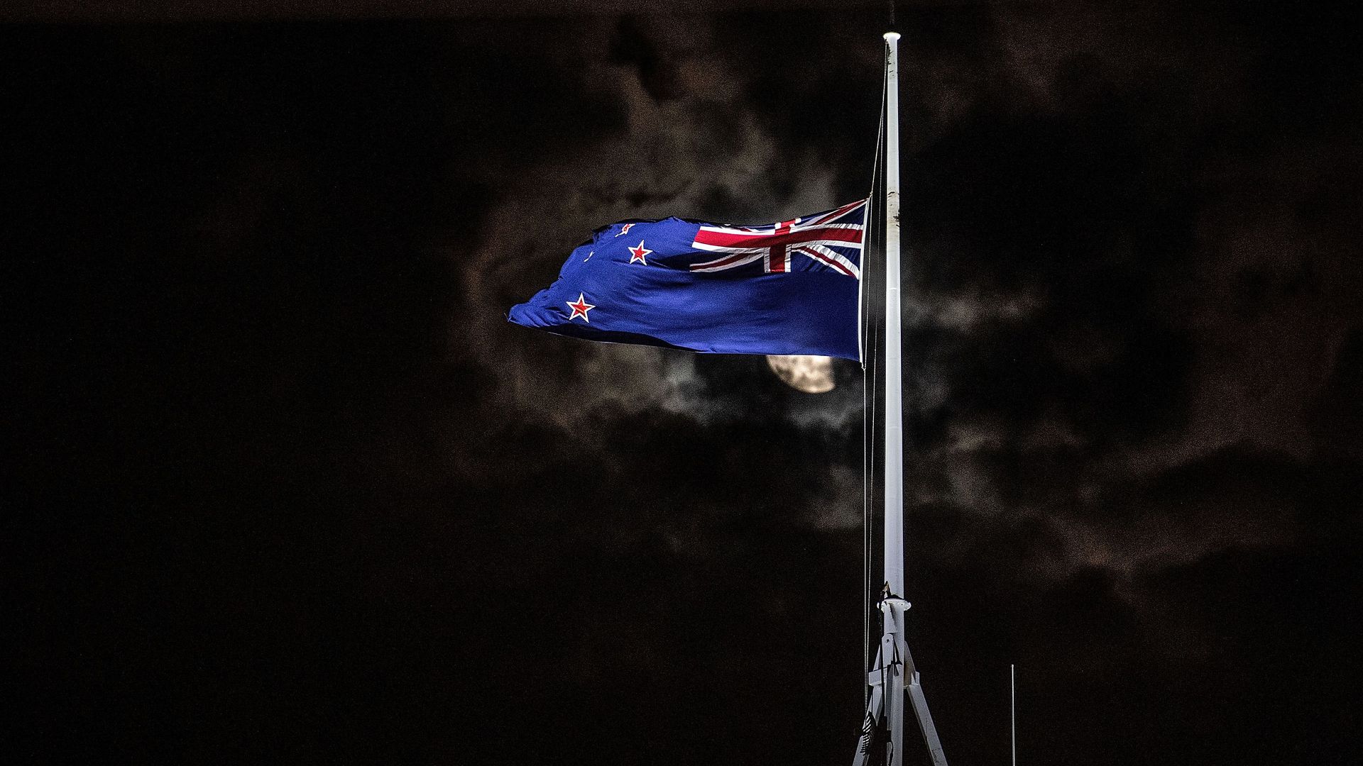 The New Zealand national flag is flown at half-mast on a Parliament building in Wellington on March 15, 2019, after a shooting incident in Christchurch.