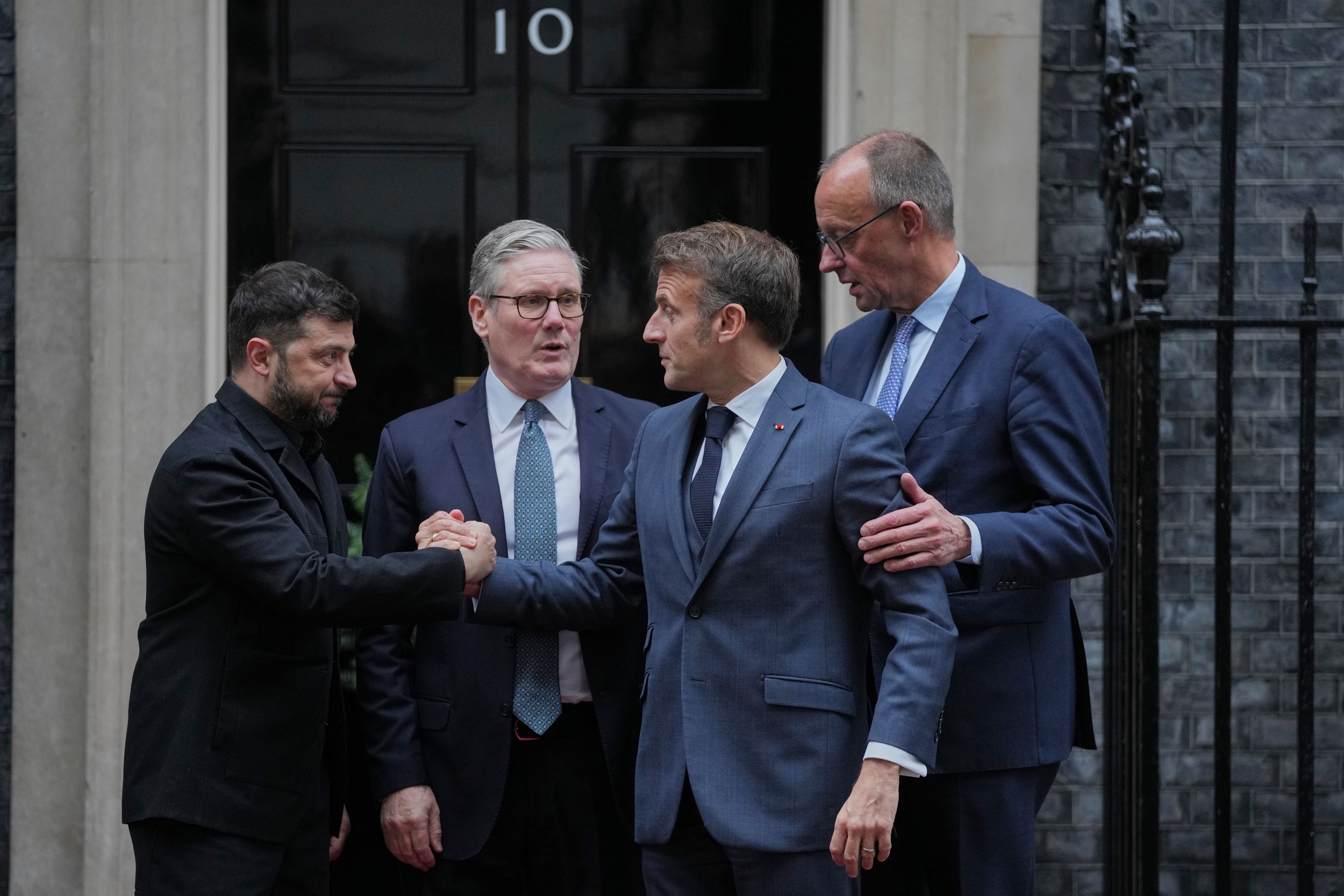 Ukrainian President Volodymyr Zelenskyy, Britain's Prime Minister Keir Starmer, French President Emmanuel Macron and German Chancellor Friedrich Merz pose on the doorstep of 10 Downing Street in London yesterday.
