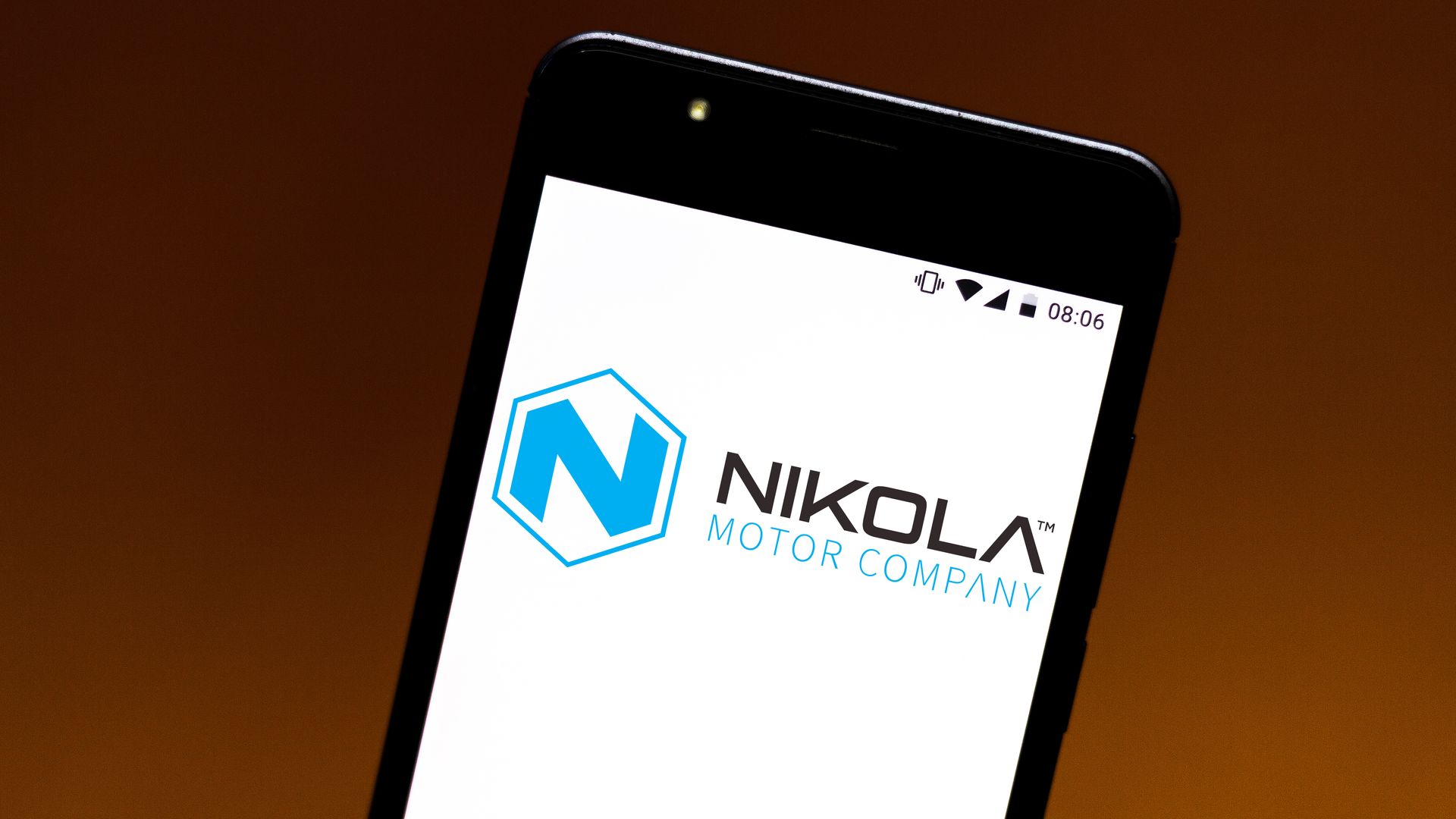 A phone displaying the Nikola logo