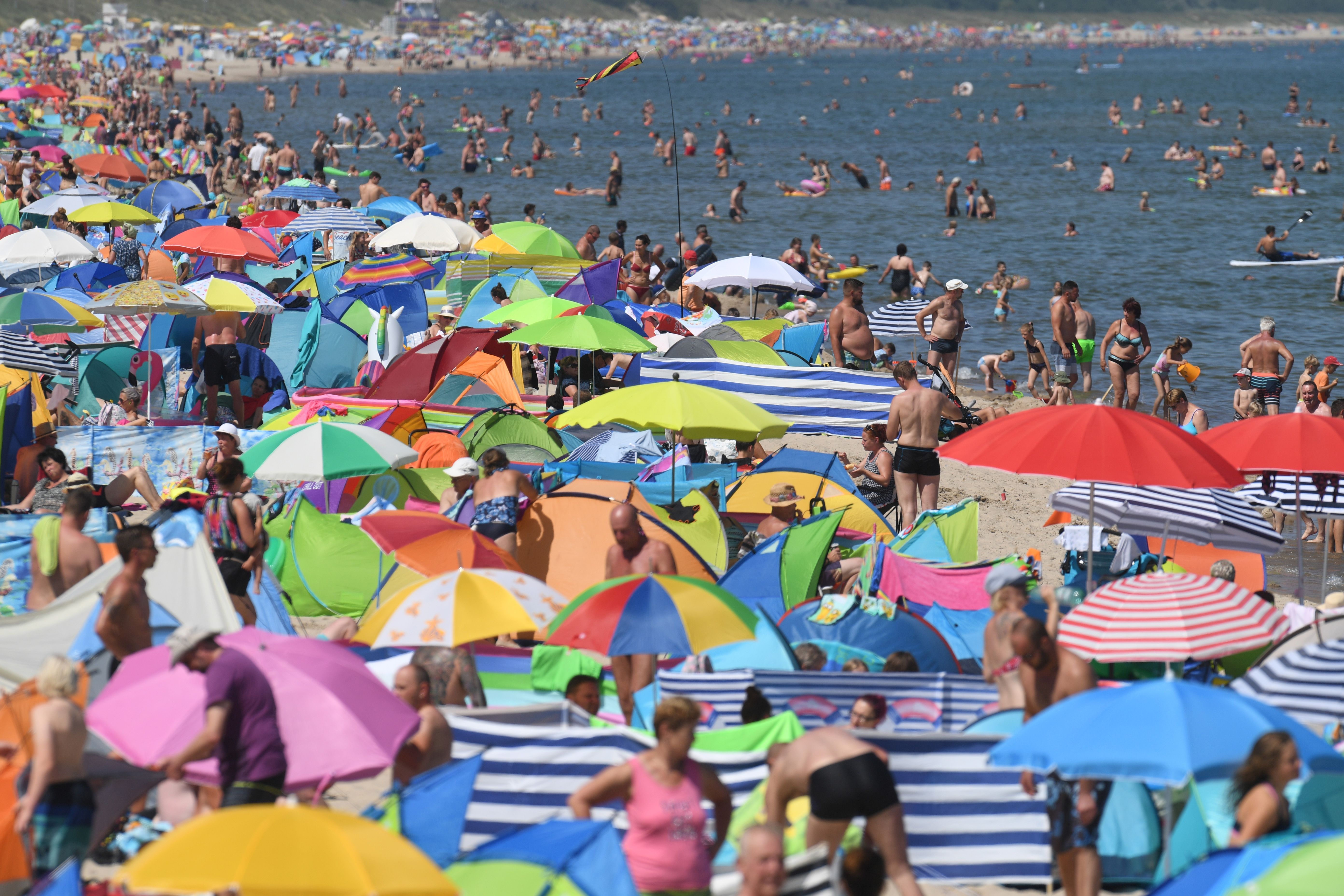 People crowd the beach at Zinnowitz on the island of Usedom in the Baltic Sea, northern Germany.