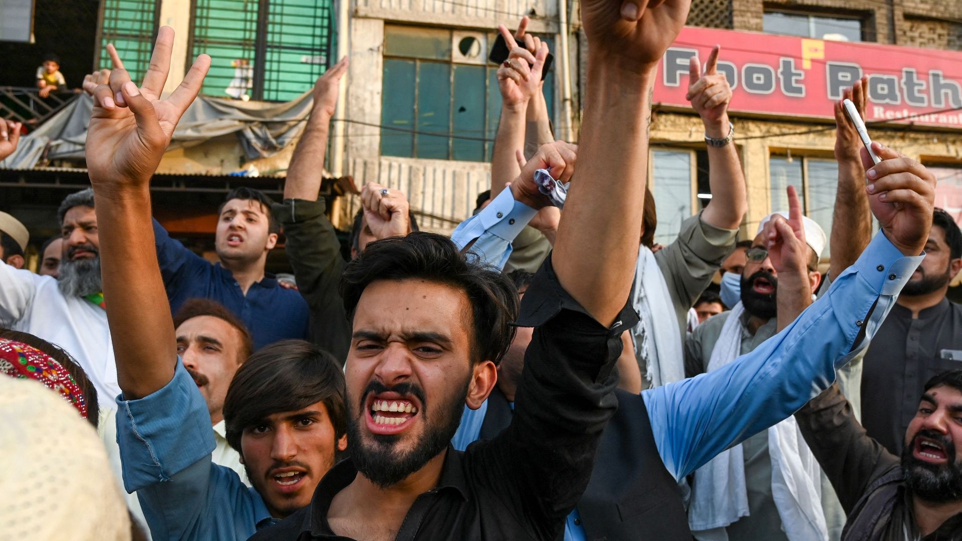 Khan supporters in Peshawar celebrate news of his release. Photo: Abdul Majeed/AFP via Getty