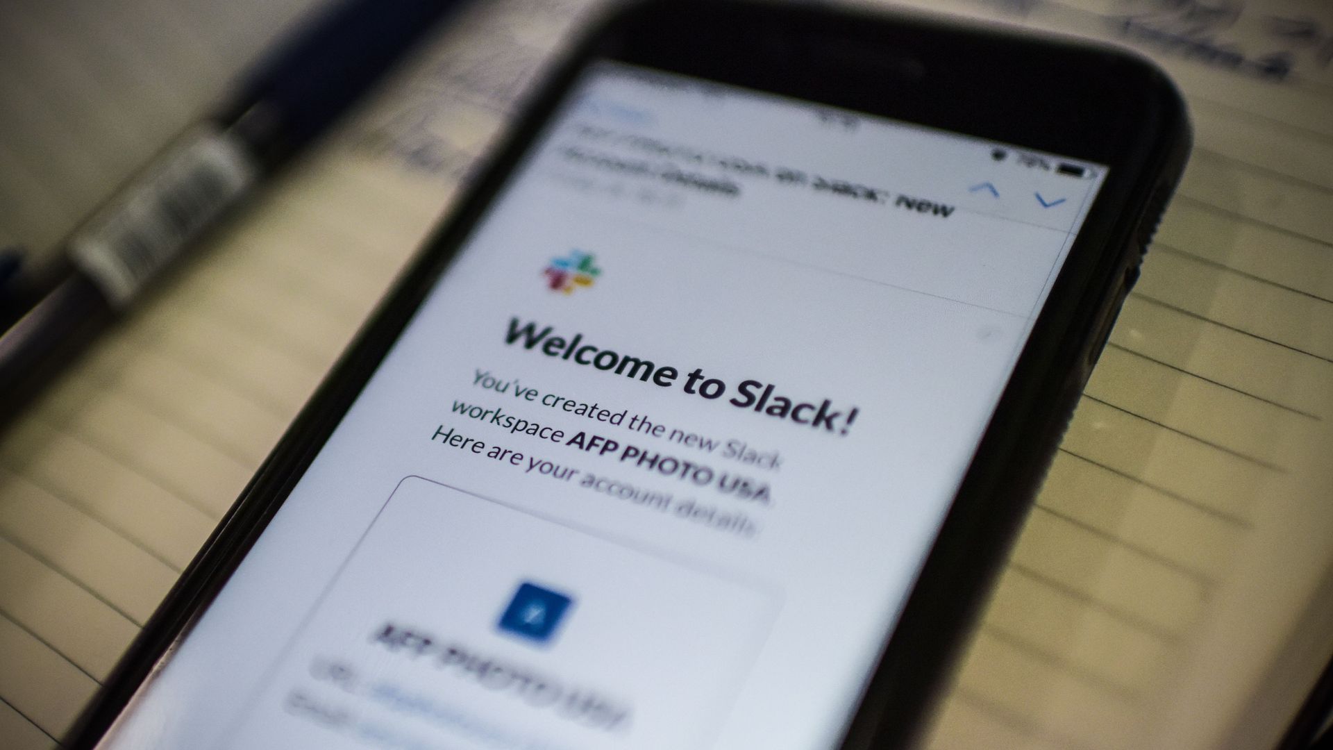 An image of a phone logging into messaging app Slack.