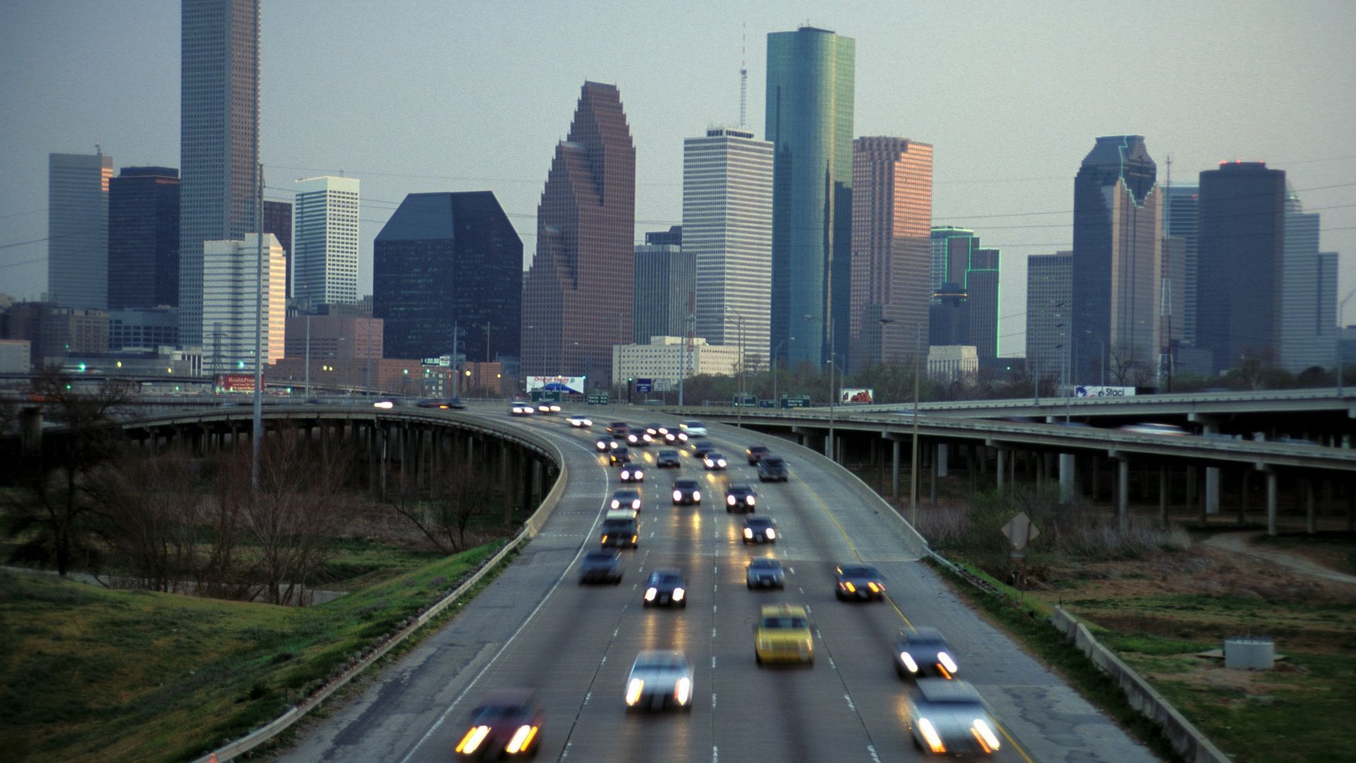 Drivers zoom along Interstate 45 with downtown Houston in the background