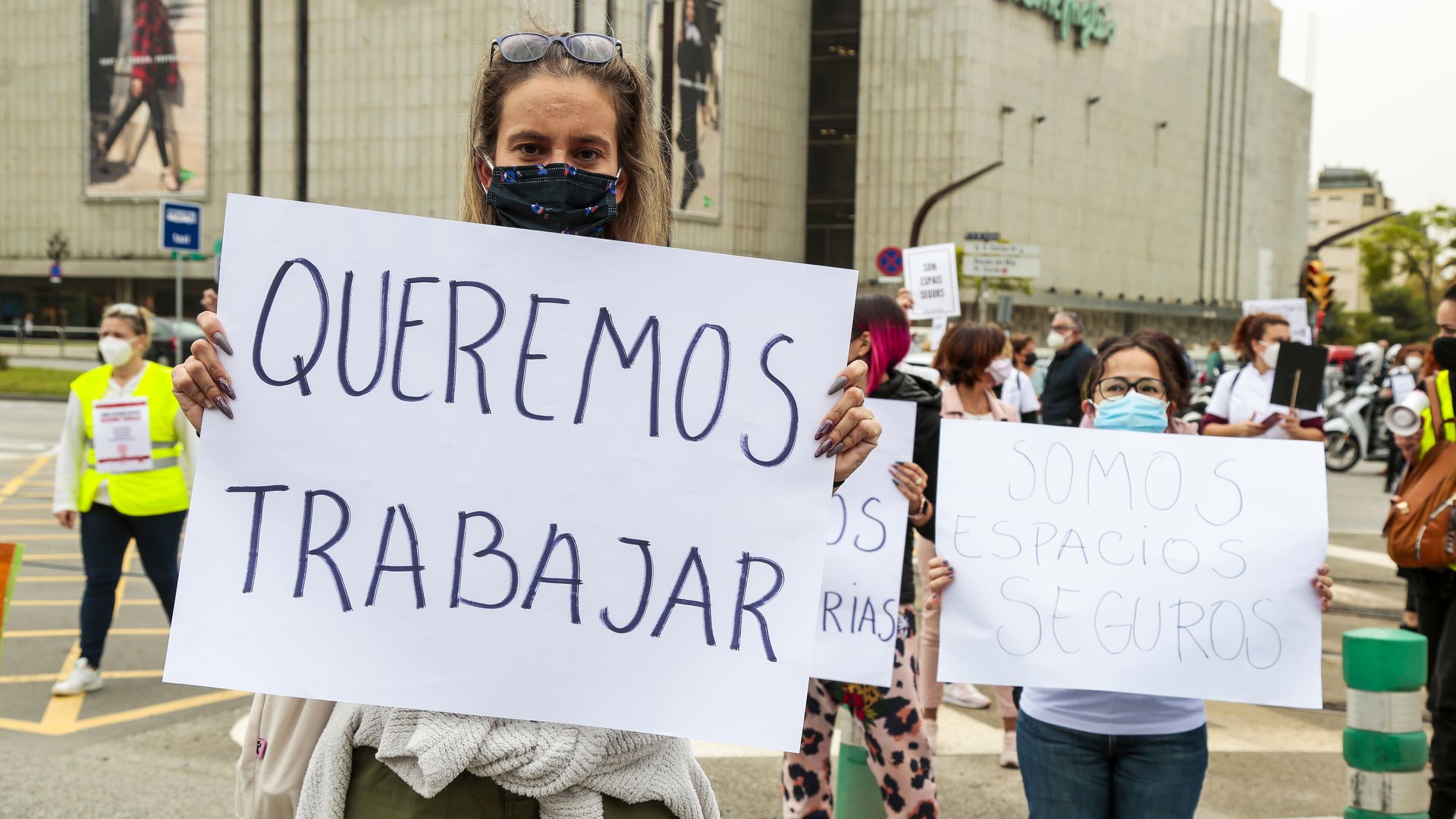 Picture of a group of workers from aesthetic and wellness centers block traffic during a demonstration against Covid lockdown measures in Spain
