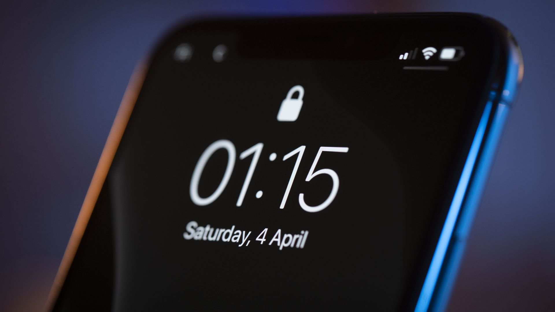 The lock screen is seen on an iPhone 11 Pro Max.
