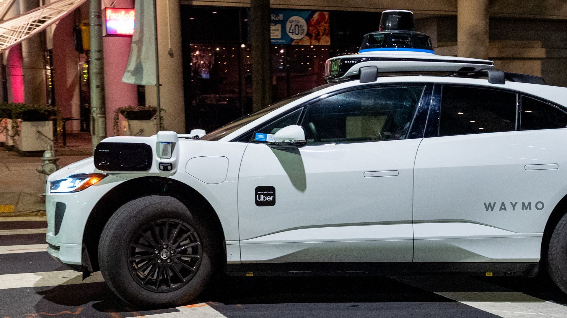 A Waymo driverless vehicle in an urban setting