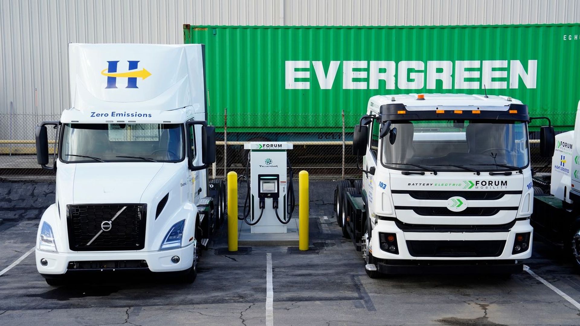Two electric drayage trucks move goods from ports in Los Angeles and Long Beach to warehouses.