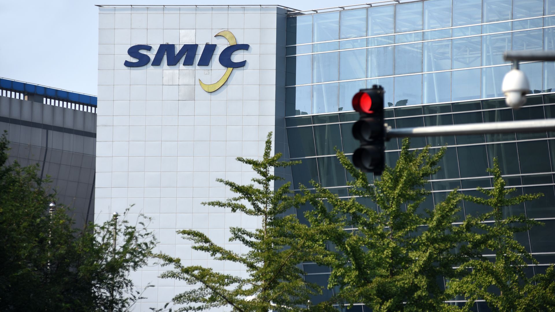 A logo hangs on the gate of the Beijing branch of Semiconductor Manufacturing International Corporation (SMIC) on September 6, 2020 in Beijing, China