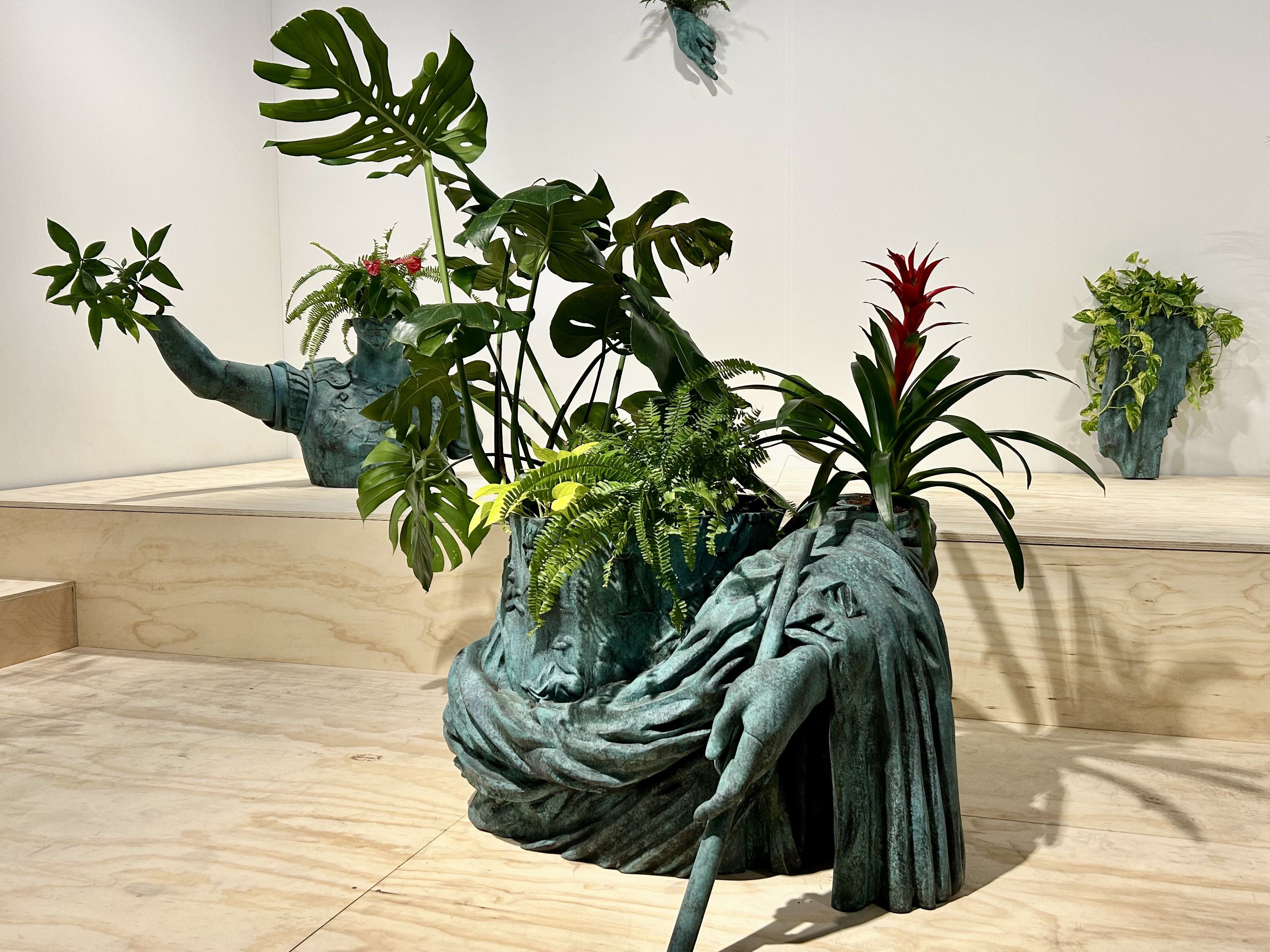 Sculptures holding flowers. 