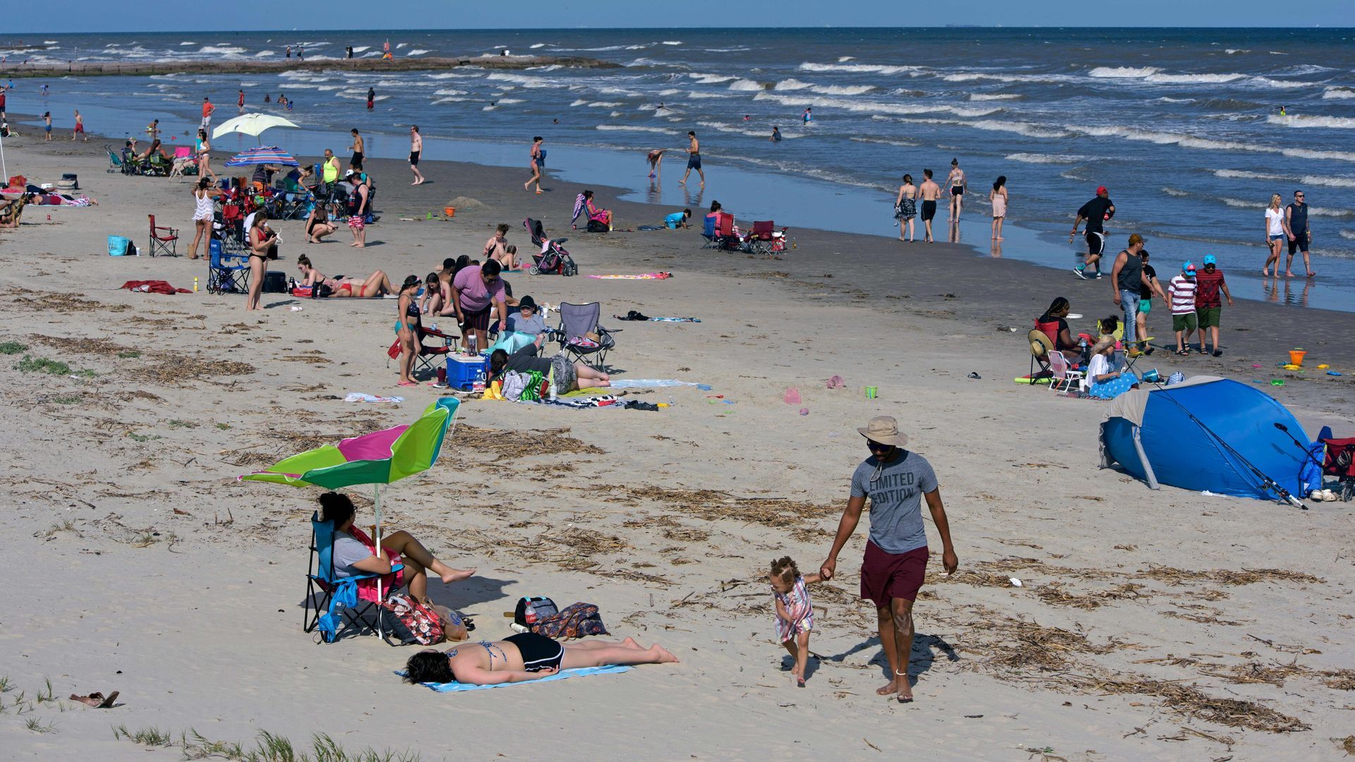 Galveston beachgoers enjoy the beach 