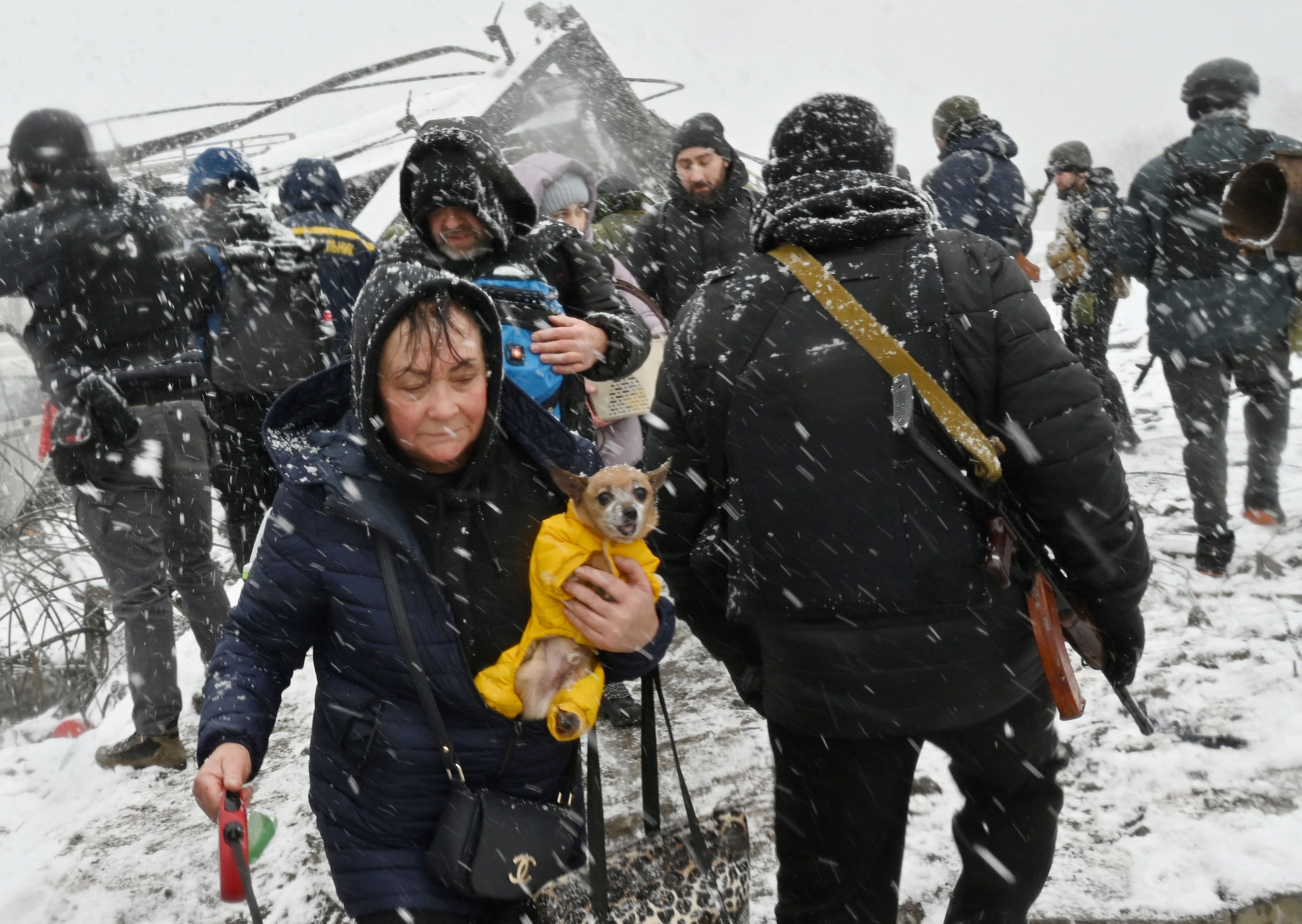  A woman carries her dog during the evacuation of Irpin, northwest of Kyiv, on March 8.