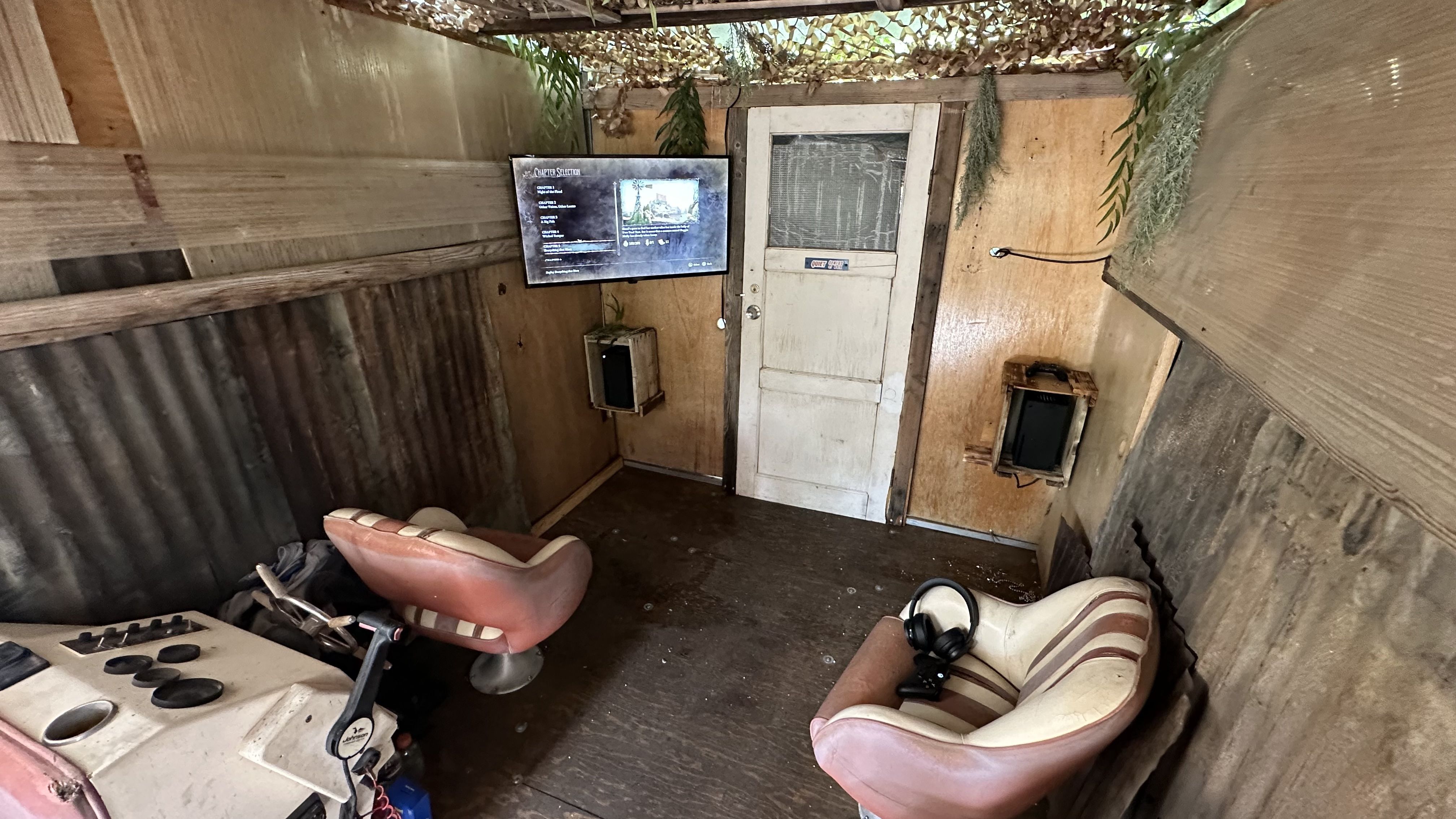 A houseboat interior with a TV on a wall.