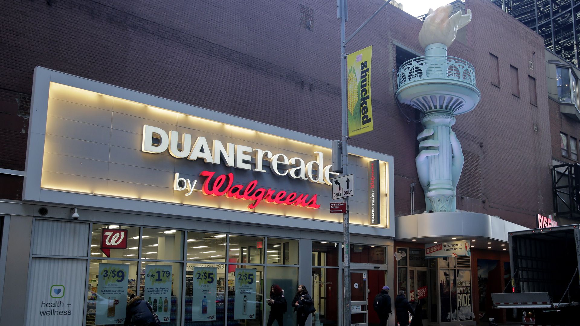  People make their way near a Walgreens pharmacy on March 09, 2023 in New York City.