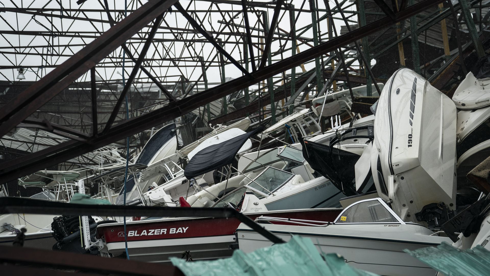 A warehouse of boats damaged