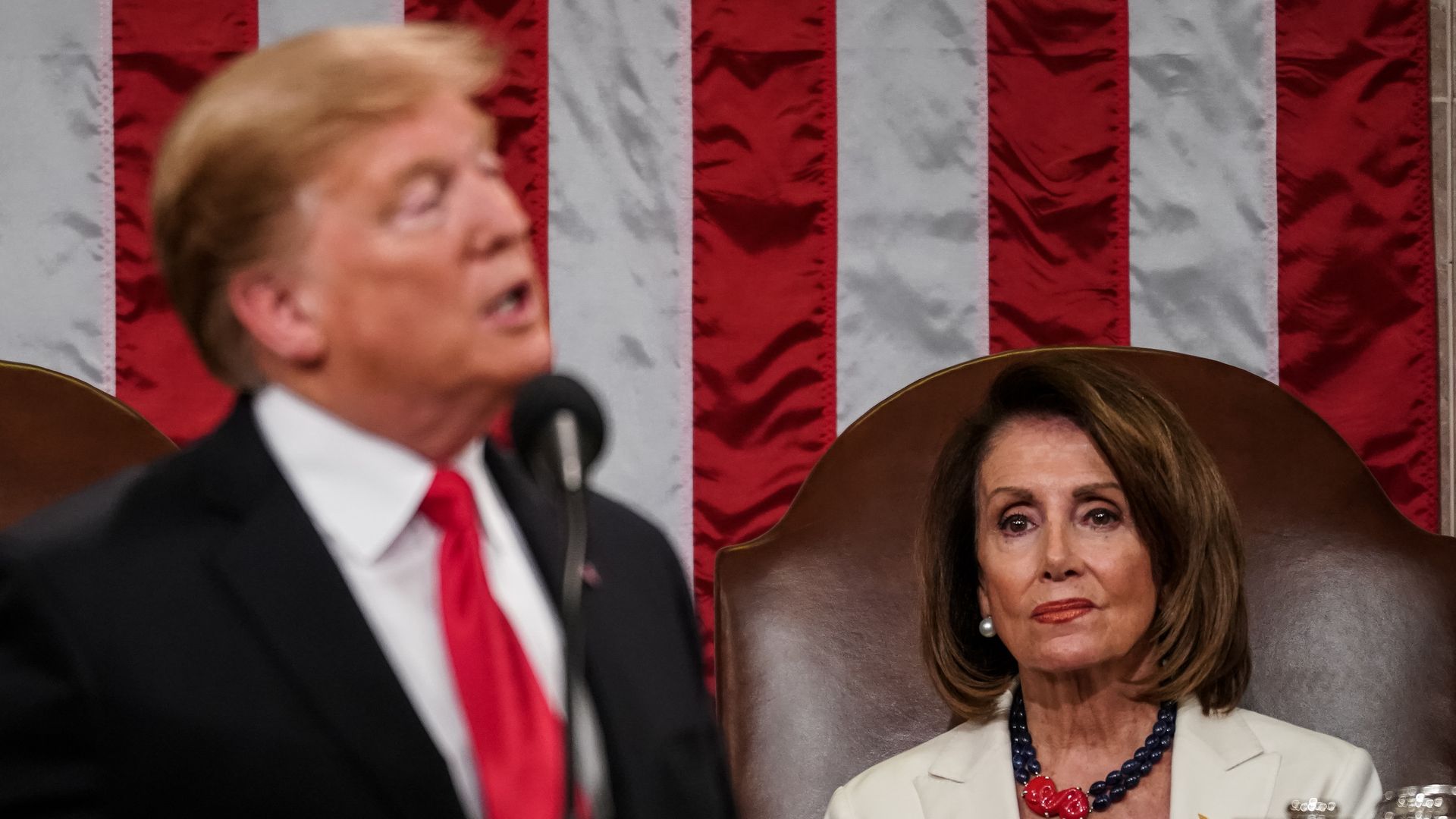 Speaker Nancy Pelosi and Vice President Mike Pence look on as U.S. President Donald Trump delivers the State of the Union address in the chamber of the U.S. House of Representatives 