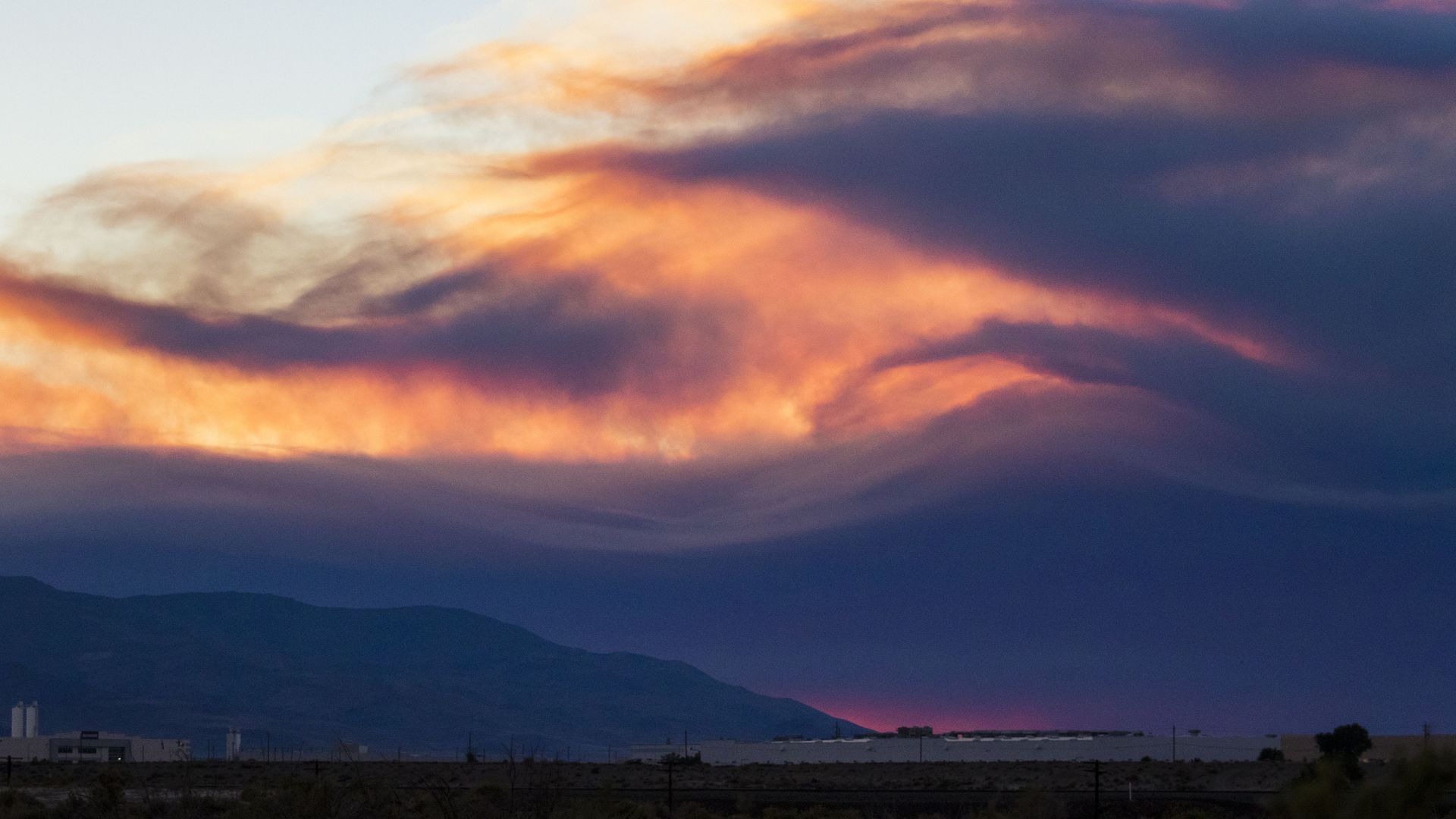 Smoke rises from the Beckwourth complex fire in Nevada. Photo: Ty O'Neil/SOPA Images/LightRocket via Getty Images