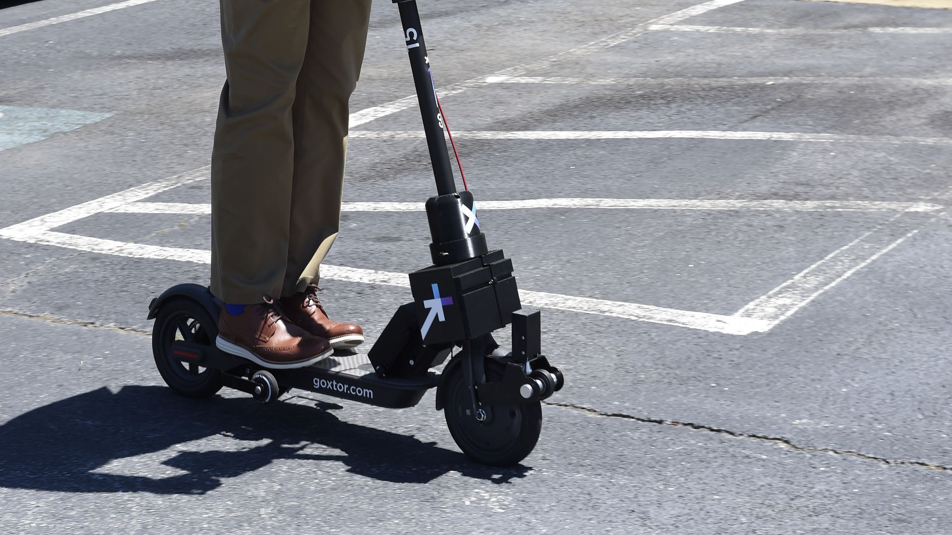 A man riding a scooter