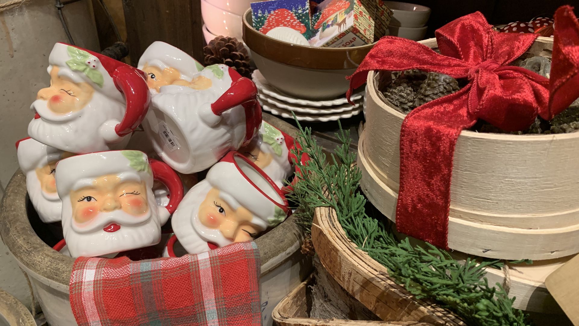 Photo of a bushel of Christmas-themed coffee mugs 