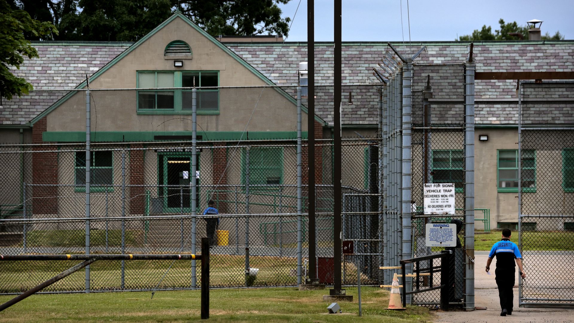 A security worker enters the decommissioned prison in Norfolk.