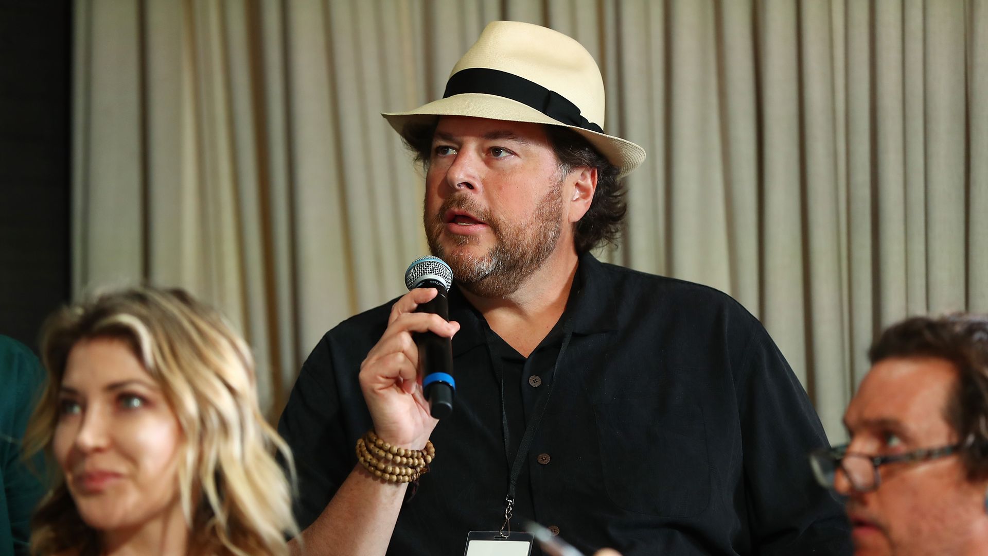Marc Benioff on stage at a conference. 