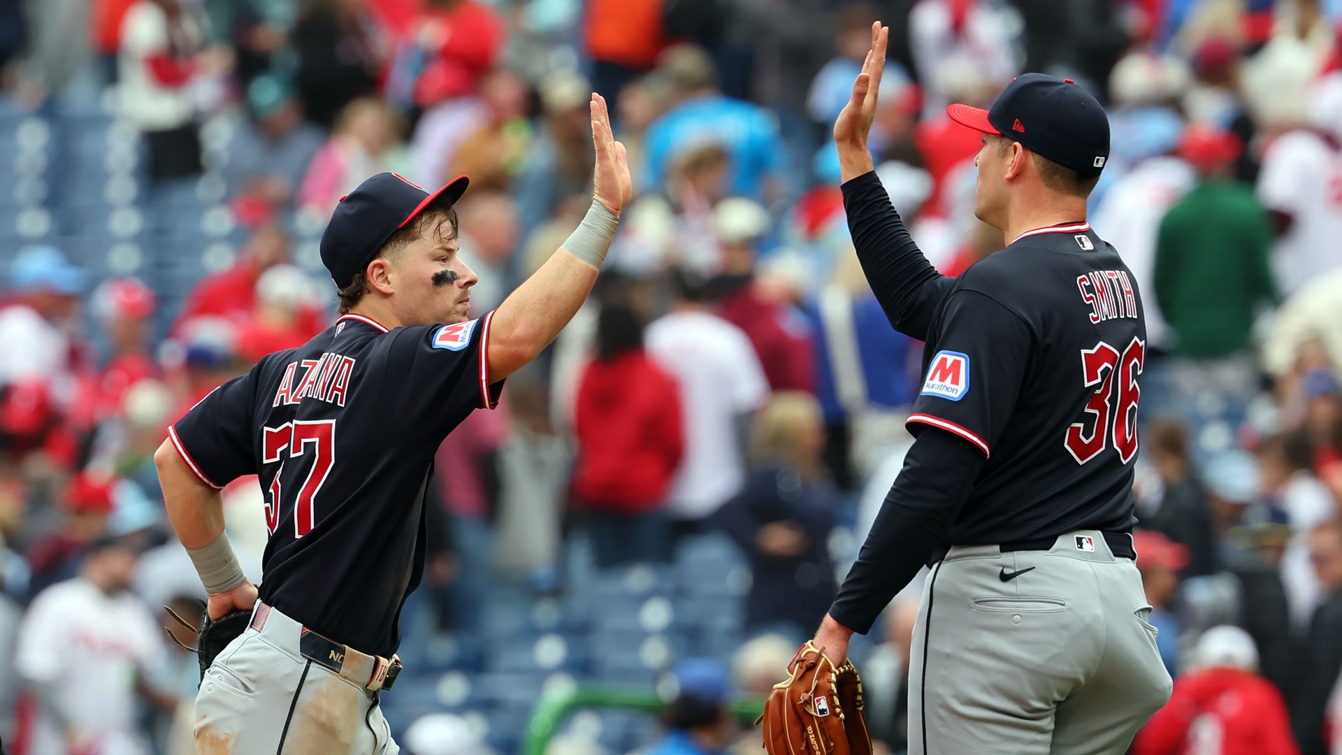 Cleveland Guardians Cade Smith and Travis Bazzana high five.