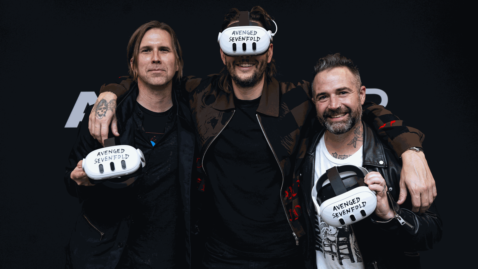 Members of Avenged Sevenfold wearing VR headsets
