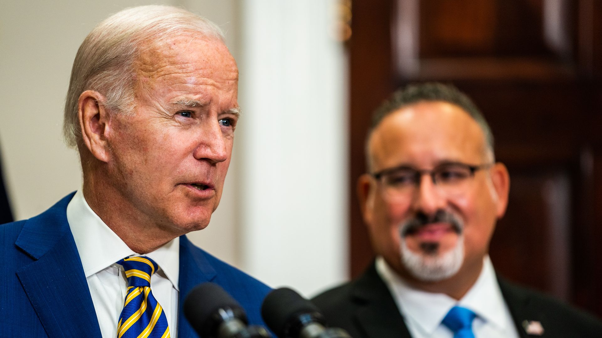 President Biden with Secretary of Education Miguel Cardona in the White House on August 2022.