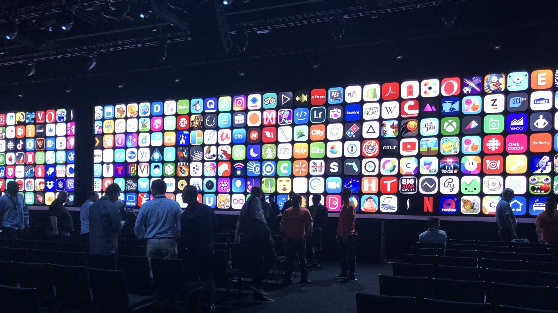 Developers before a wall of app icons at Apple's WWDC 2018.