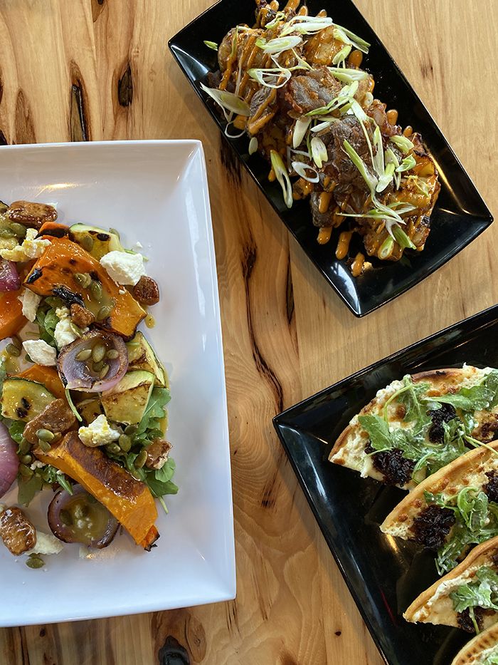 grinning mule plaza midwood restaurant food spread