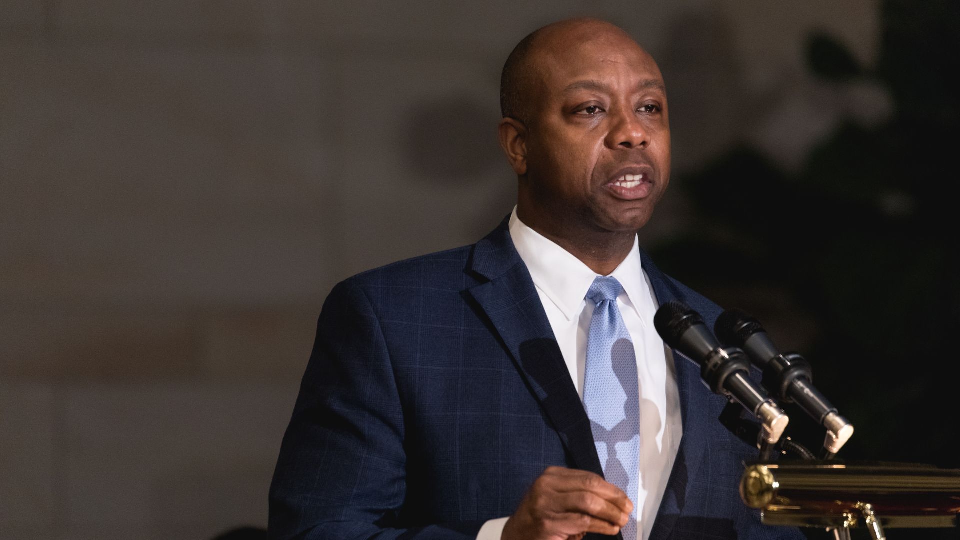 Senator Tim Scott speaks at a podium