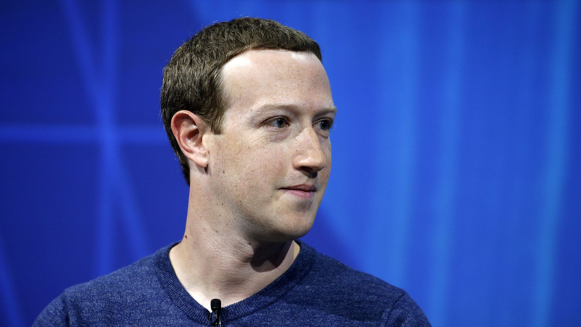 Mark Zuckerberg with a blue shirt on