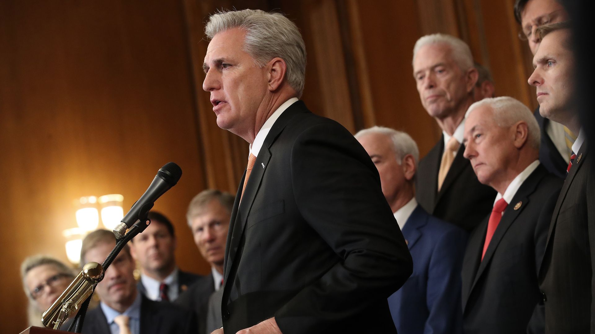 Rep. Kevin McCarthy flanked by GOP members, mostly white men.